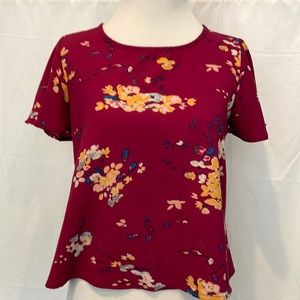 Xs polo, polyester/spandex blouse, maroon
